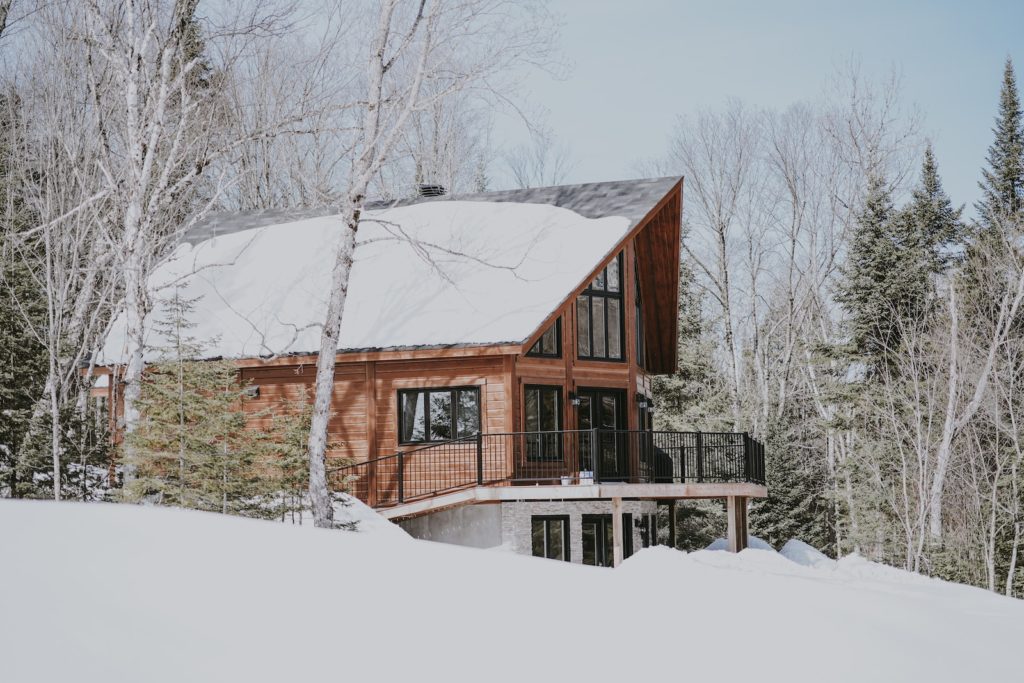 cabin near snowy forest